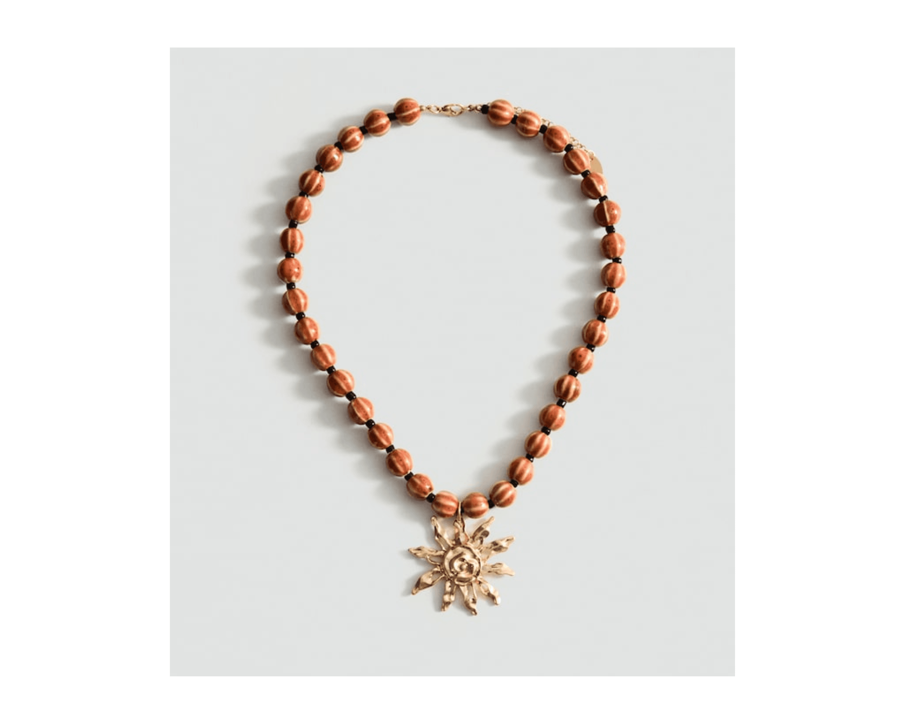 Ceramic ball necklace with sun pendant